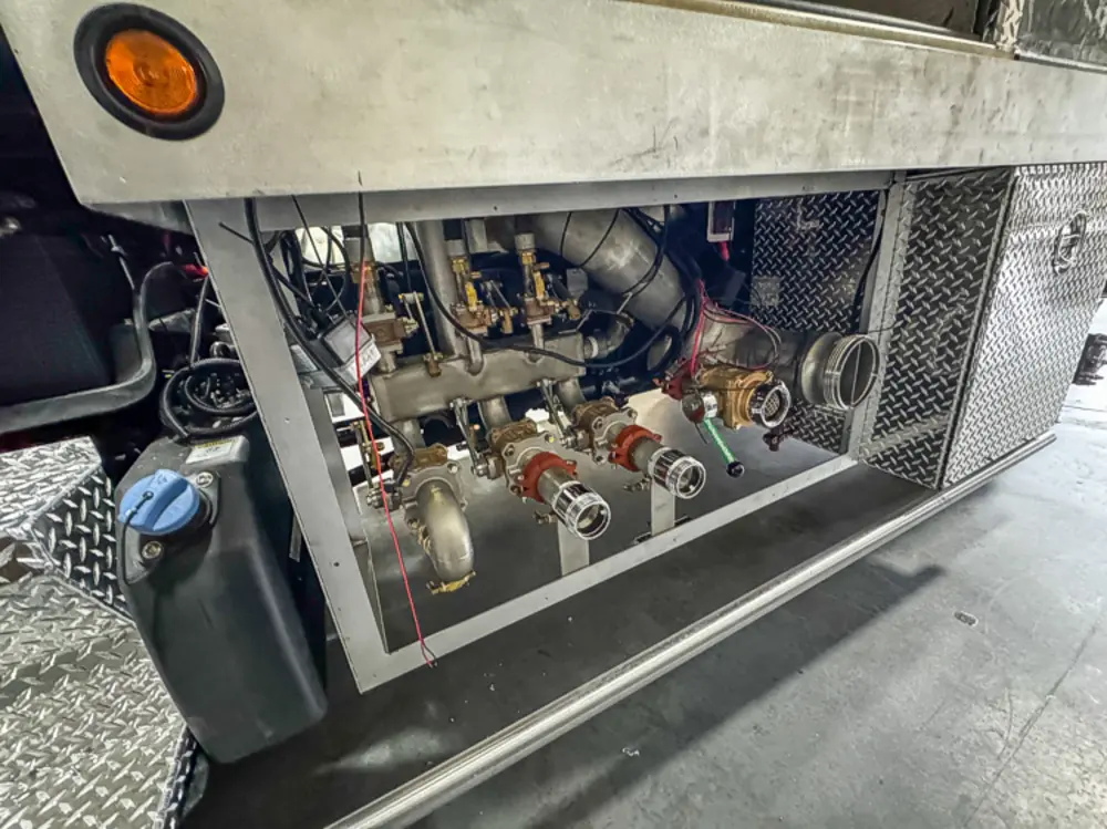 Diamond-plate body and step detail in production, photo 48 of 303.